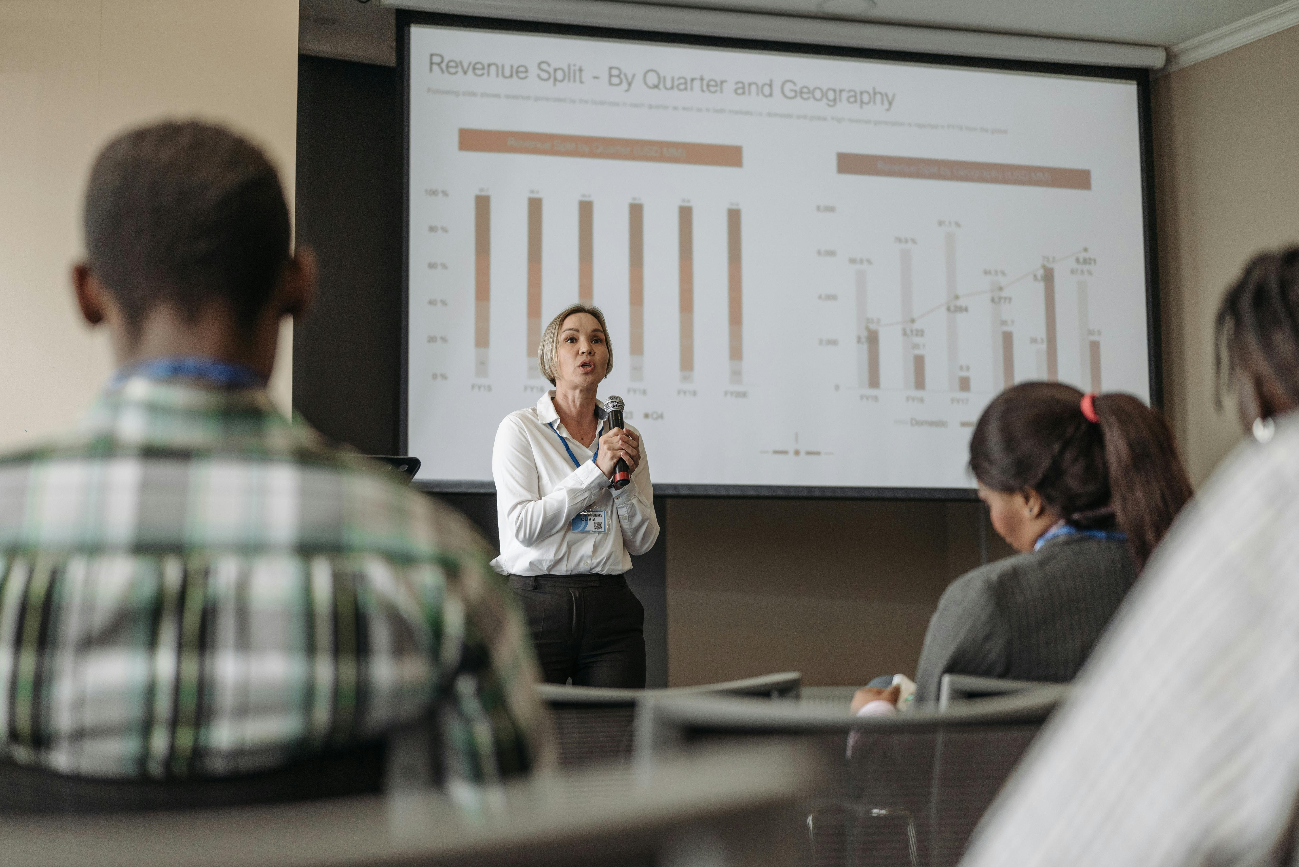 A woman is presenting the financial health of the association focusing on financial sustainability from non-dues revenue.